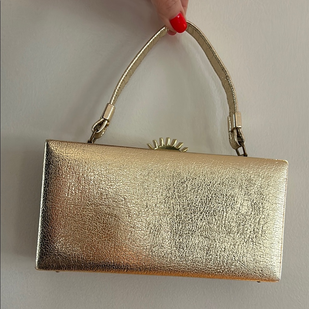 Metallic Gold Clutch with Elegant Closure and Arched Handle